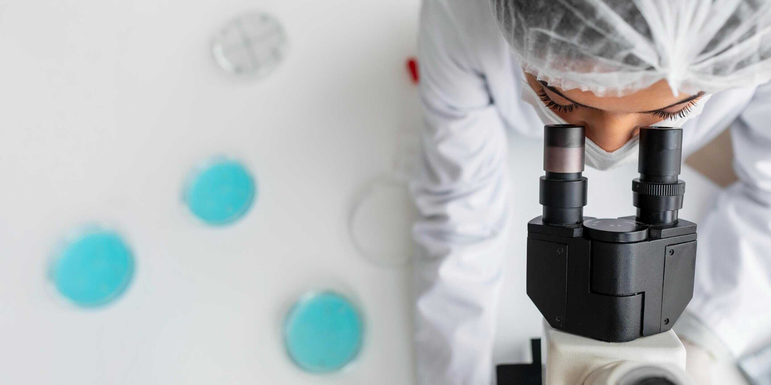 close-up-researcher-looking-through-ocular-lens